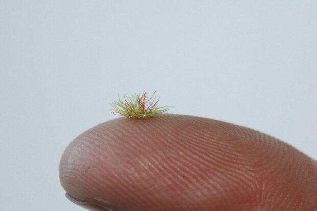 Green coloured grass tufts 2mm (+/- 260)